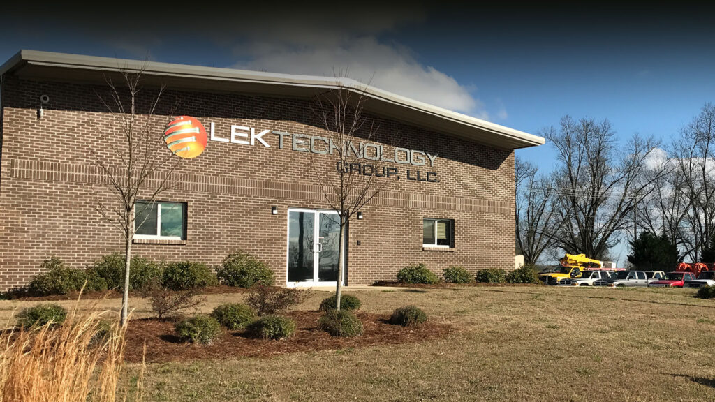 LEK's Prattville office with bucket truck behind, homepage banner on lektech.com